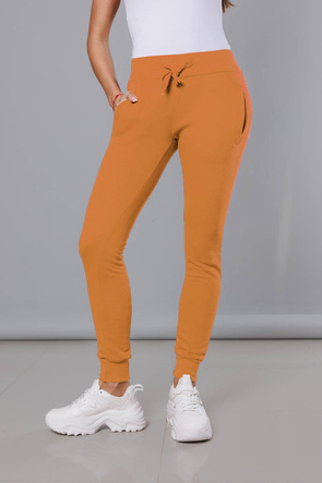 Musztardowe damskie dresowe spodnie casualowe z kieszeniami i ściągaczem