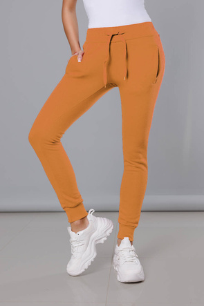 Musztardowe damskie dresowe spodnie casualowe z kieszeniami i ściągaczem