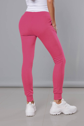 Różowe damskie dresowe spodnie casualowe z kieszeniami i ściągaczem